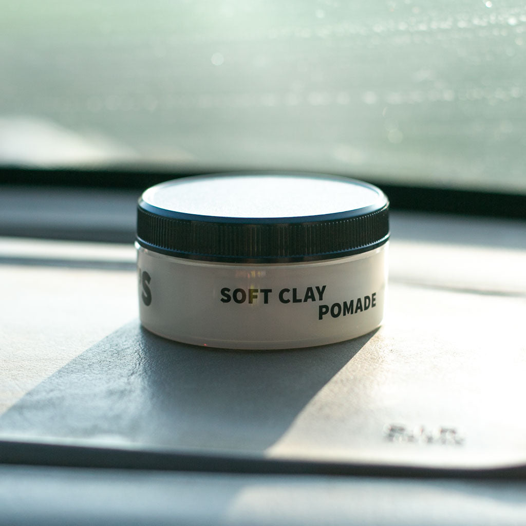 Soft Clay Pomade container on dash of car