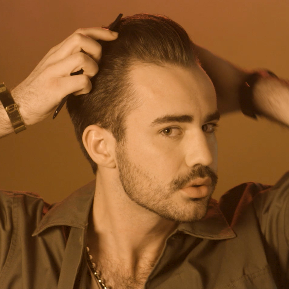Image of a man with styled hair with Shine Pomade